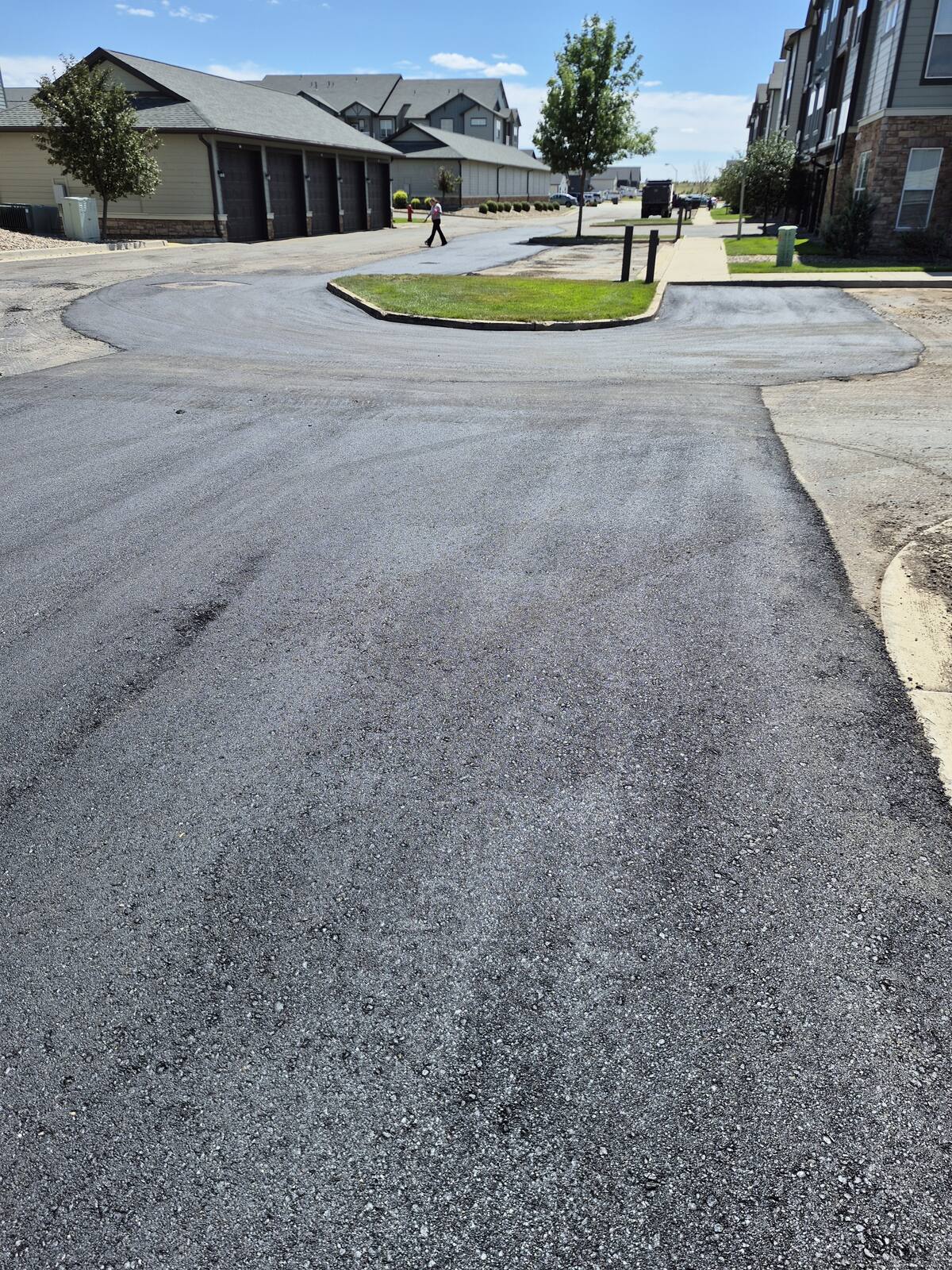 Patched drive lane between apartment garages