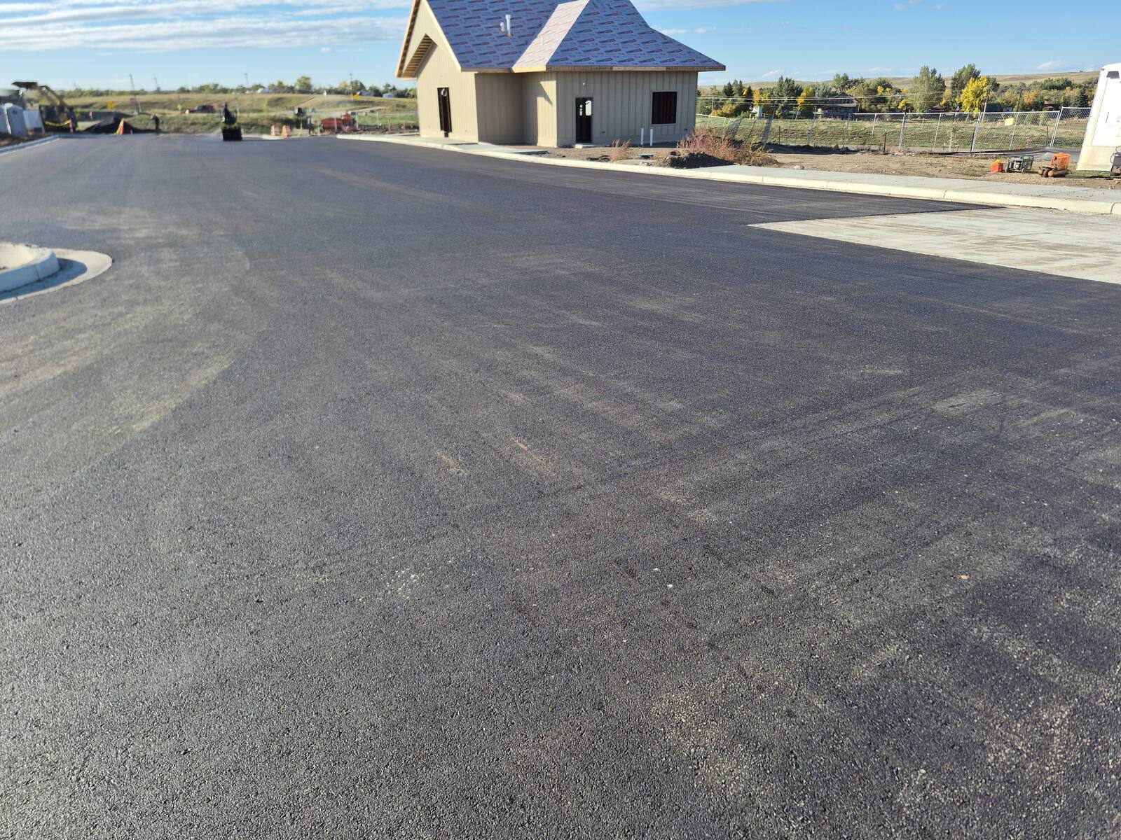 Finished parking lot and drive lane beside the new community building