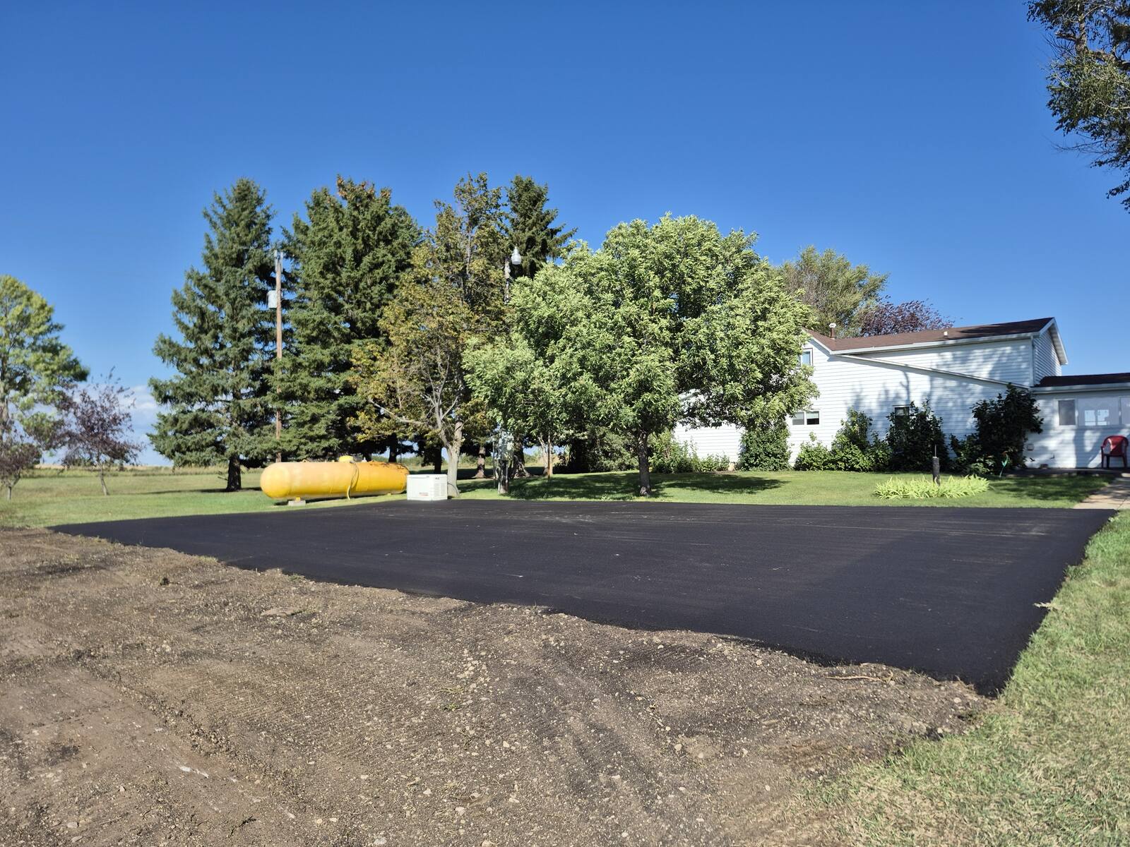Same parking pad after a 2-inch asphalt overlay