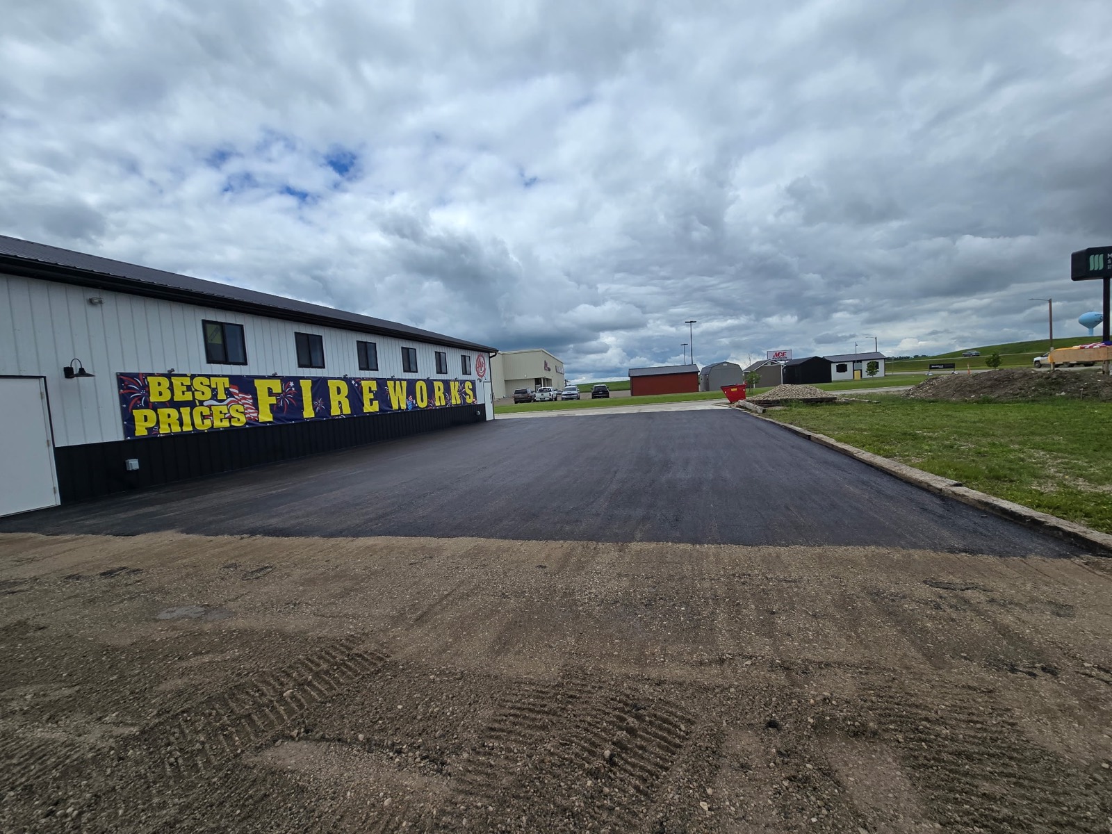 Freshly paved asphalt lot in front of the fireworks stand