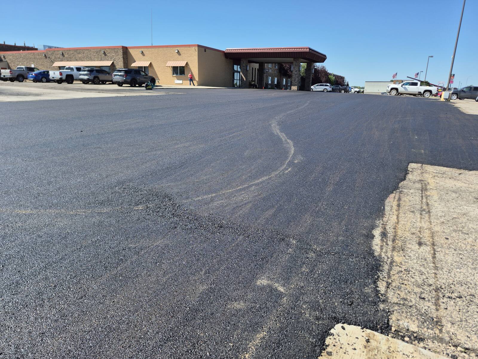 Finished asphalt at the Grand Williston Hotel entrance