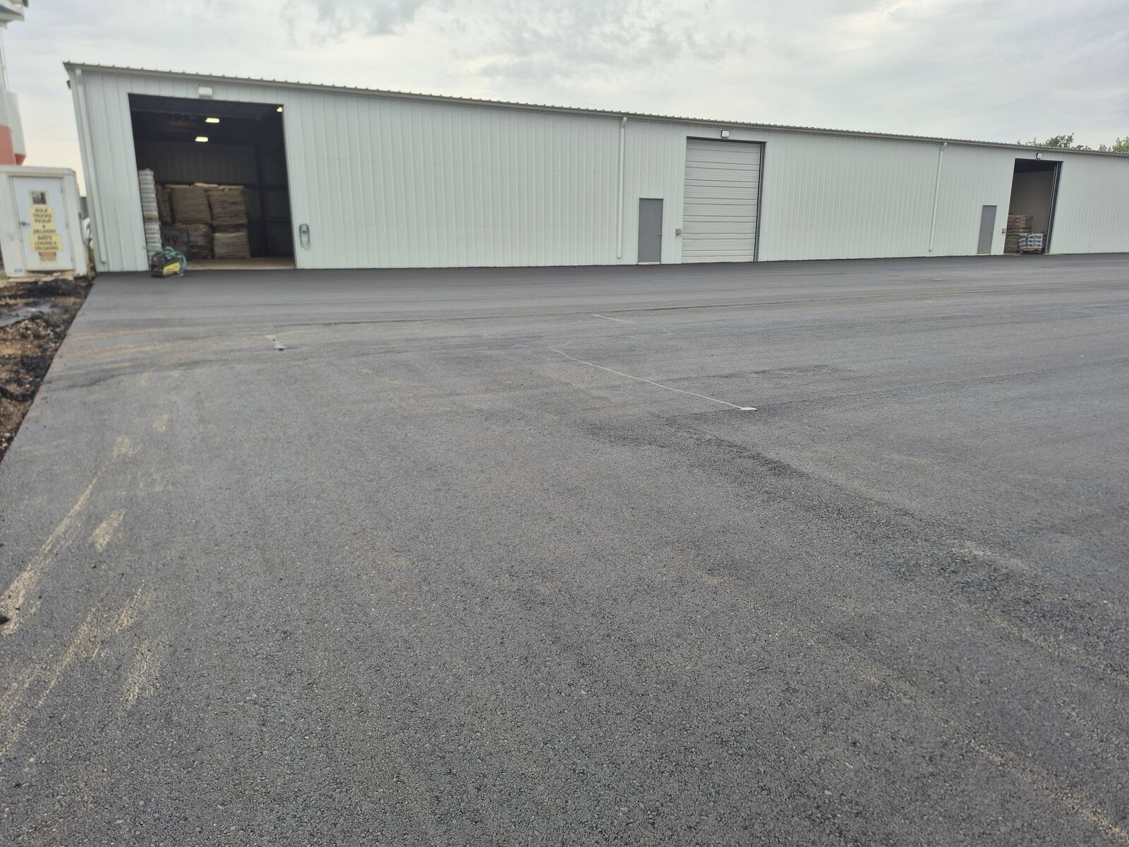 New asphalt apron at the shop overhead doors