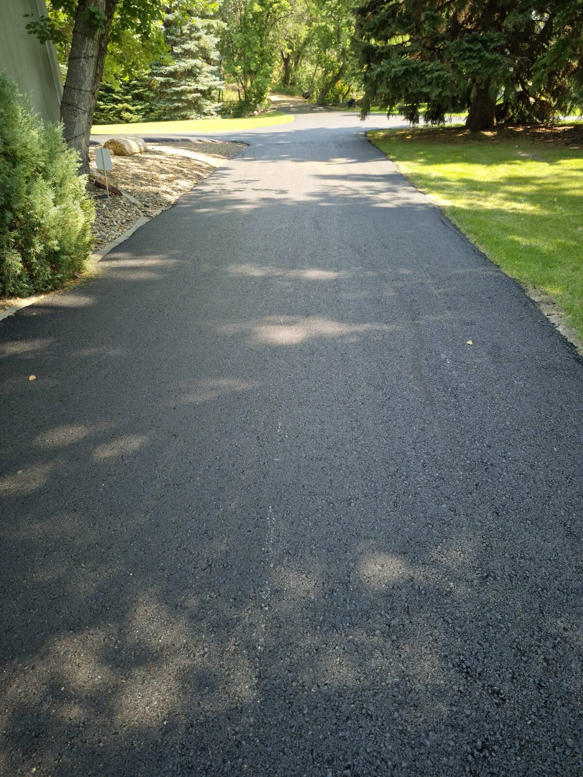 Wide curve of the overlaid driveway